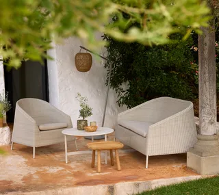 Kingston lounge chair by Cane-line in Mocca, small round Weave, None – interior photo 1 of 2