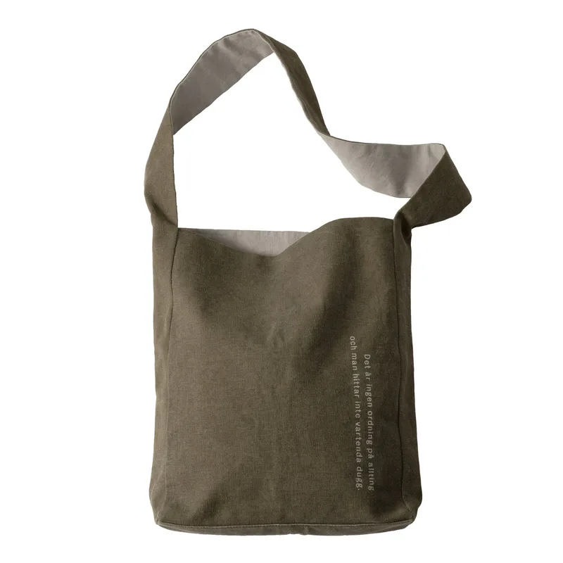 Astrid Lindgren Tote Bag by Design House Stockholm in Olive (Det är ingen ordning på allting...) – product photo