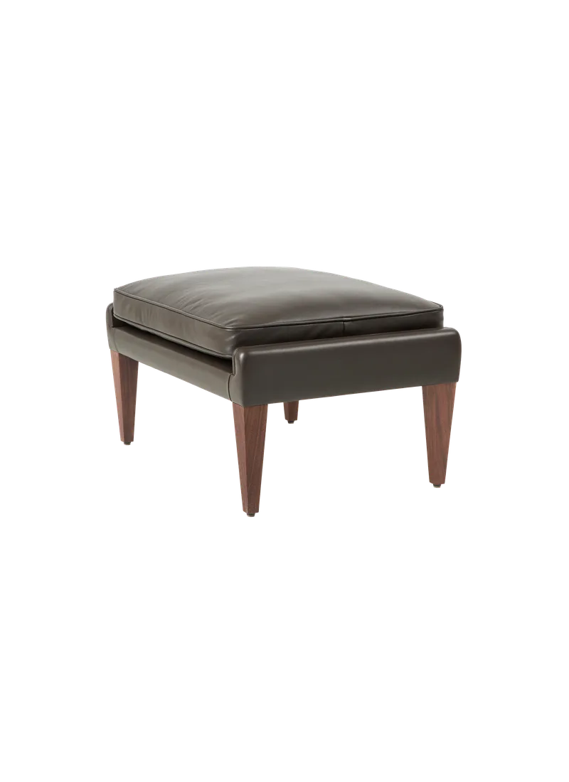 V11 Ottoman by GUBI in Smooth leather, GUBI (Coffee, Standard), Solid American Walnut (Oiled) – product photo