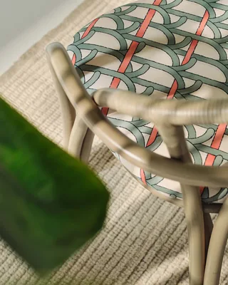 Bistra Dining Armchair by GUBI in Reales Pattern, GUBI (001, Standard), Olive Stained Rattan – interior photo 6 of 7