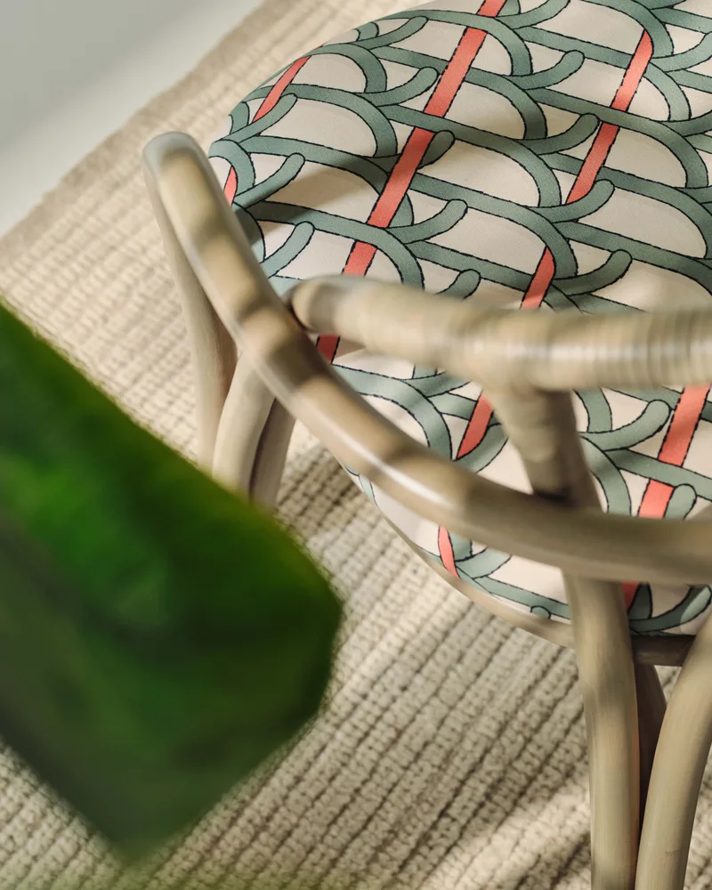 Bistra Dining Armchair by GUBI in Reales Pattern, GUBI (001, Standard), Olive Stained Rattan – interior photo 6 of 7