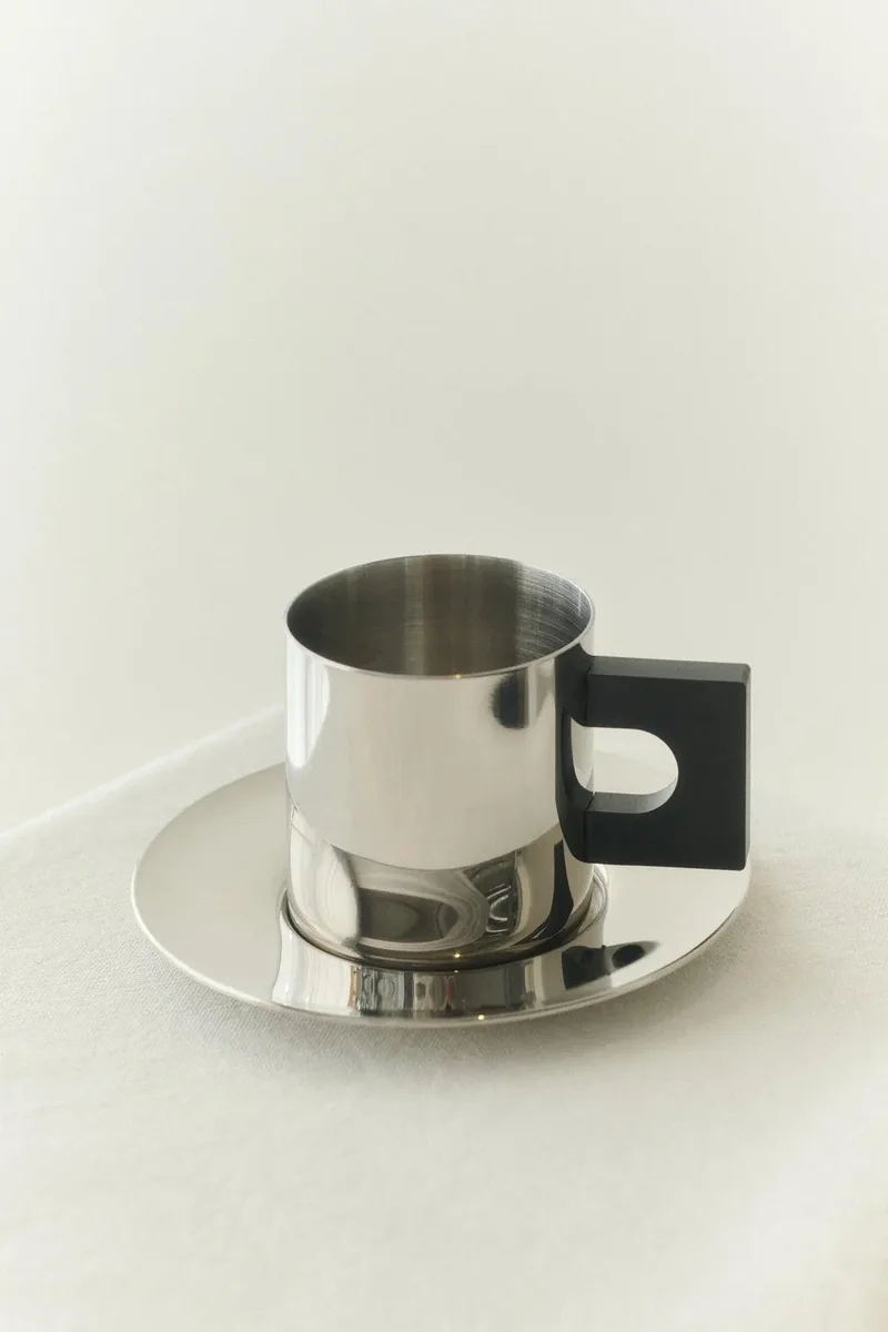 S.R. METAL CUP & SAUCER by LOUISE ROE – product photo