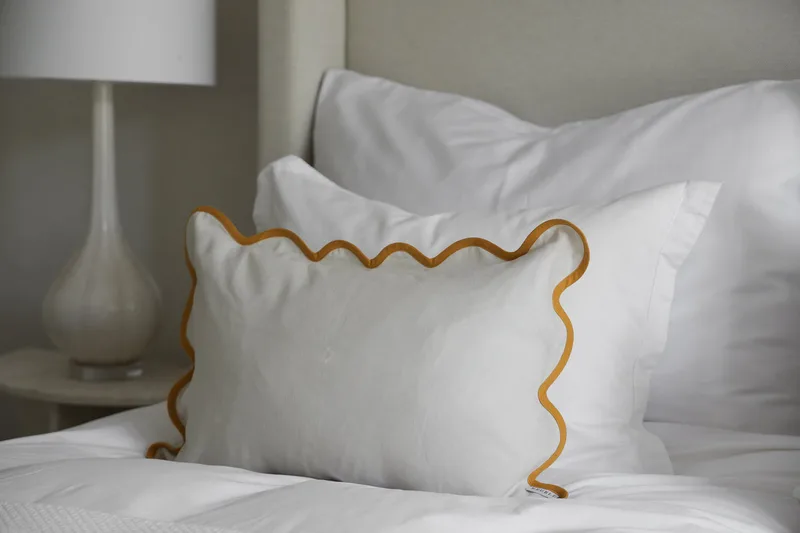 Poppy Cushion Cover - Ochre van Meublé – sfeerfoto